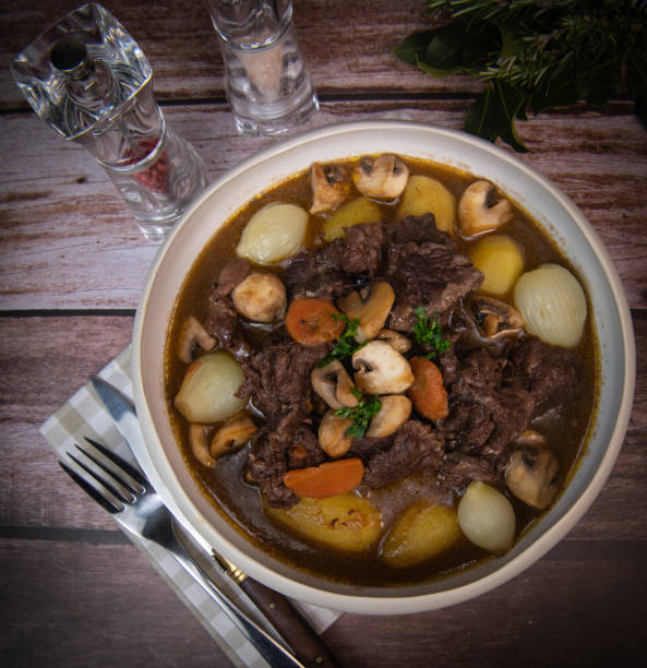 istock Beef bourguignon recipe, beef stew with wine sauce and vegetables 1465013384