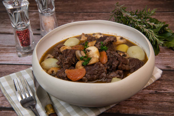 istock Beef bourguignon recipe, beef stew with wine sauce and vegetables 1465013387