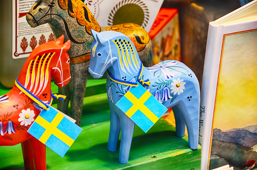 Traditional swedish Dala horses in souvenir shop of Stockholm