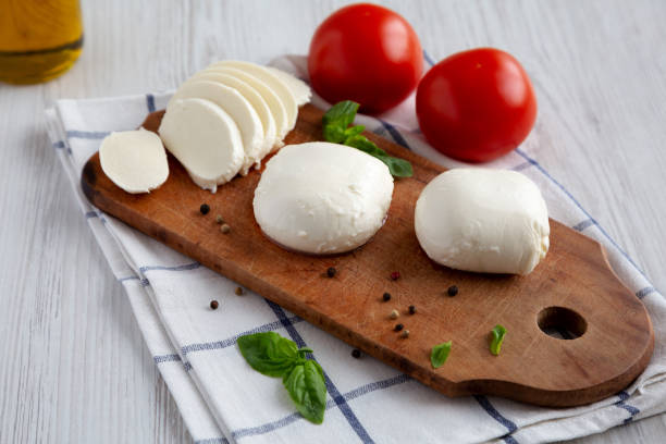 istock Homemade Mozzarella Cheese with Tomato, Basil and Olive Oil, low angle view. 1465023623
