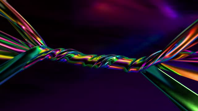 Ribbons of a metallic rainbow color are tightly twisted together against an abstract background. Binding. Interlacing.