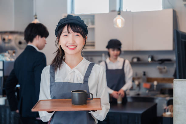 Cafe staff working with a smile stock photo