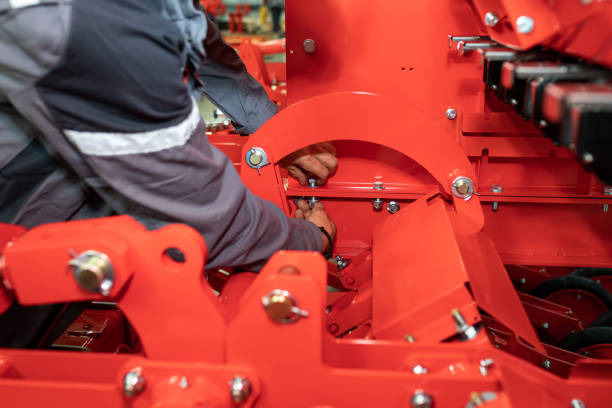 istock Worker tighten screw. Assembly stage of agricultural machine 1465030667