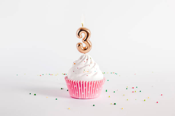 istock Birthday cupcake with number four candle on white background 1465031651