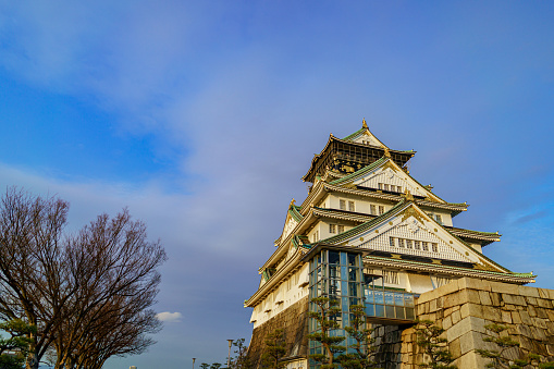 Osaka, Japan - 03 February, 2023. A winter day shot outside Osaka Castle in Osaka, Japan. This area attracts thousands of locals and tourists every year and offers some amazing walks and scenery, Tourists flock here to experience of Japanese cultural tourism.