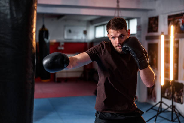 istock Lightweight Young White Male Kickboxer Training At The Gym 1465033548