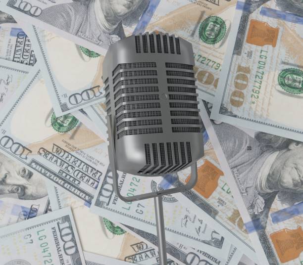 istock Bidirectional microphone on the stack of money 1465035435