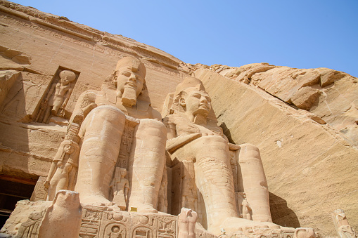 Abu Simbel, Aswan , Egypt - January 31, 2023: Abu Simbel is a historic site comprising two massive rock-cut temples in the village of Abu Simbel. It is situated on the western bank of Lake Nasser, about 230 km (140 mi) southwest of Aswan. The twin temples were originally carved out of the mountainside in the 13th century BC, during the 19th Dynasty reign of the Pharaoh Ramesses II. They serve as a lasting monument to Ramesses II.