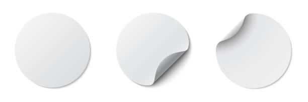 istock Circle adhesive symbols. White tags, paper round stickers with peeling corner and shadow, isolated rounded plastic mockup, realistic set round paper adhesive sticker mockup with curved corner 1465040493
