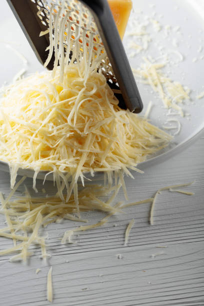 istock Grated cheese and grater. 1465043853