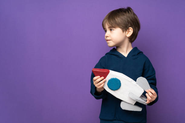 istock Little boy plays and fun with space rocket 1465050150
