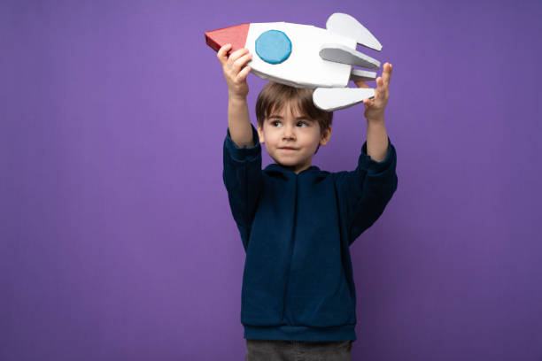 istock Little boy plays and fun with space rocket 1465051515