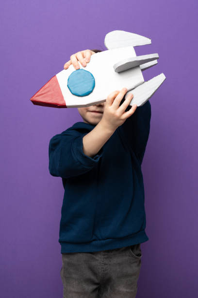istock Little boy plays and fun with space rocket 1465051783