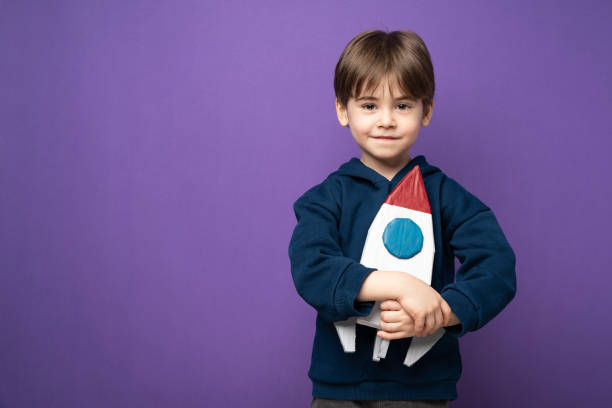 istock Little boy plays and fun with space rocket 1465051868