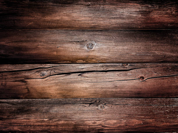istock Cracked weathered dark brown wood texture 1465052402
