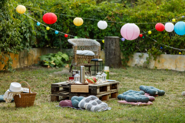 Garden party setting in a backyard is filled with lush greens, colorful blooms, and the sweet scent of summer, creating a truly immersive and unforgettable experience for everyone in attendance.