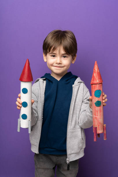 istock Little boy plays and fun with space rocket 1465054951