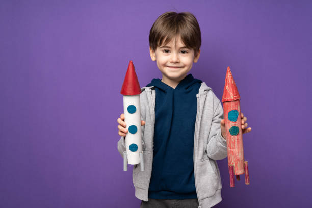 istock Little boy plays and fun with space rocket 1465056043