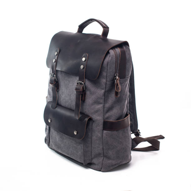 istock Canvas Backpack accessories isolated on white background. Hand made backpack for travelers. 1465056072