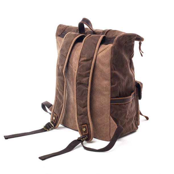 istock Canvas Backpack accessories isolated on white background. Hand made backpack for travelers. 1465056074