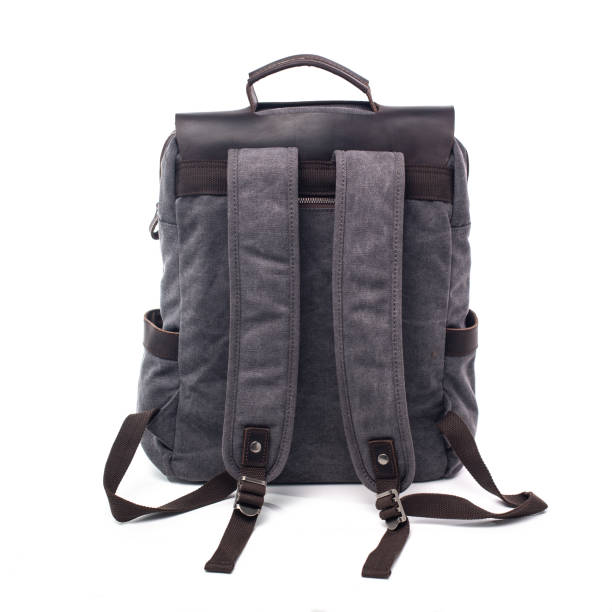 istock Canvas Backpack accessories isolated on white background. Hand made backpack for travelers. 1465056079