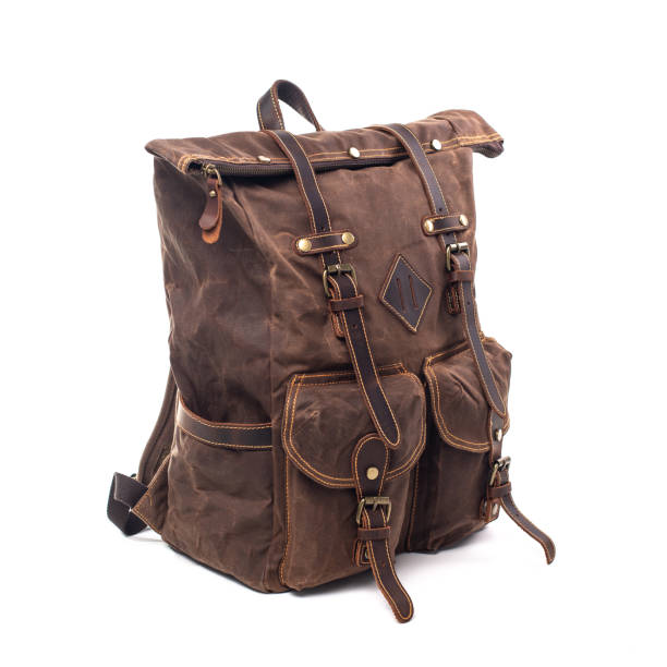 istock Canvas Backpack accessories isolated on white background. Hand made backpack for travelers. 1465056087