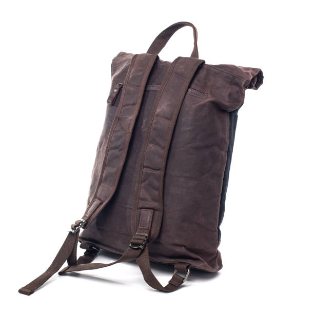 istock Canvas Backpack accessories isolated on white background. Hand made backpack for travelers. 1465056089