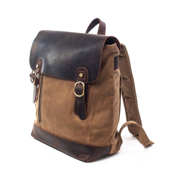 istock Canvas Backpack accessories isolated on white background. Hand made backpack for travelers. 1465056113