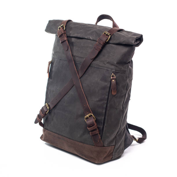 istock Canvas Backpack accessories isolated on white background. Hand made backpack for travelers. 1465056129
