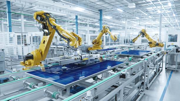 large production line with industrial robot arms at modern bright factory. solar panels are being assembled on conveyor. automated manufacturing facility - 自動化 個照片及圖片檔