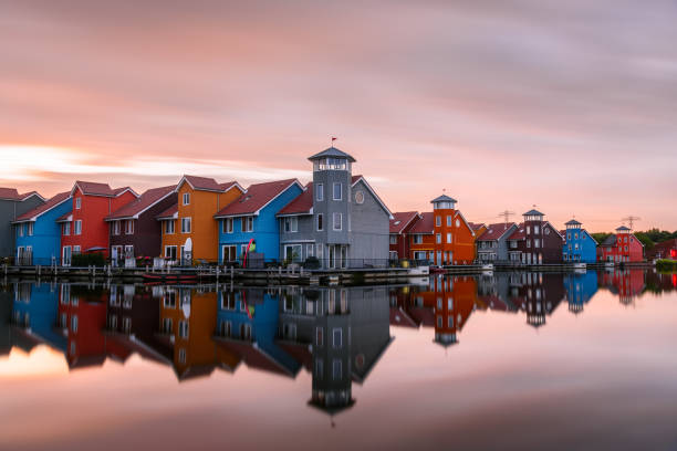 istock Colourful terraced houses on a harbour at sunset 1465059824