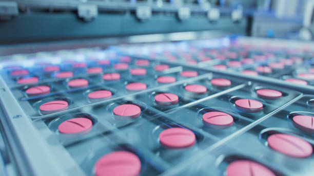 istock Macro Shot of Pink Pills During Production and Packing Process on Modern Pharmaceutical Factory. Medical Drug Manufacturing. 1465073080