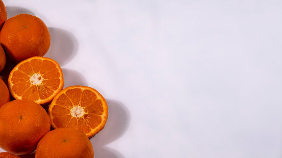 Fresh tangerines in a wicker basket, vitamin C