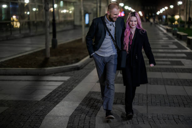istock A young man is spending a wonderful night with girlfriend in city walk. 1465076992