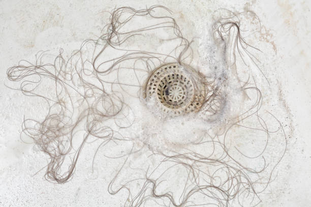 Fallen piled up hair in the bathtub stock photo