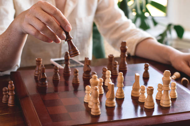 istock Woman is playing game of chess 1465081127