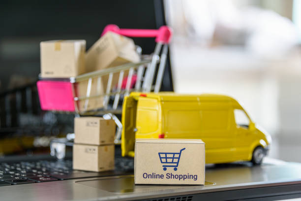 istock Online shopping, logistics, supply chain and shipment service, e-commerce concept : Boxes of goods, a shopping cart, delivery van on a laptop, depicting buyers place order or make purchases online. 1465081810
