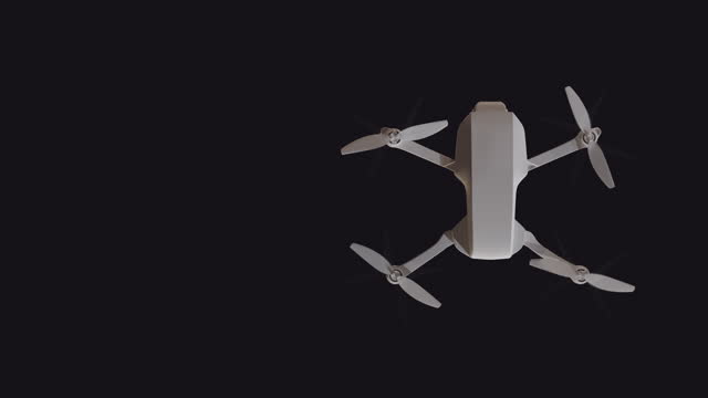 Top view of a flying drone with rotating propellers on a black background with an empty place to insert. Looped animation.
