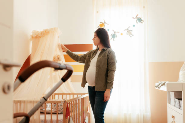 istock Mother to be in infants room. 1465096216