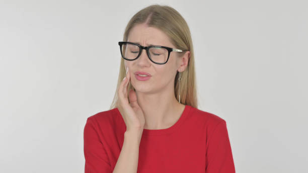 young woman having toothache on white background - 11305 imagens e fotografias de stock