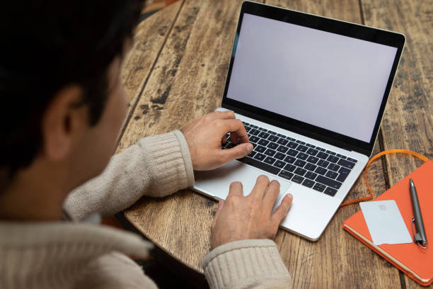 istock A professional man working with a laptop in a cafe 1465102486