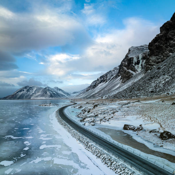 A remote road against a dramatic frozen backdrop in Eastern Iceland in winter