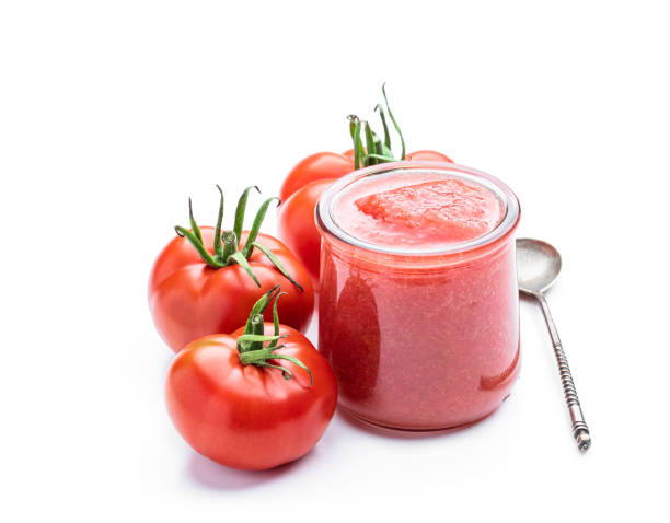 istock Fresh tomato sauce and ripe tomatoes isolated on white background 1465106877