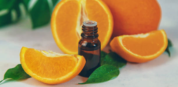 istock Orange essential oil in a small bottle. Selective focus. 1465110656
