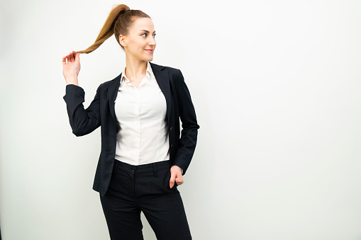 portrait of young business woman on white background