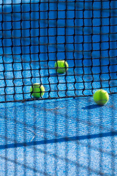 tennis ball and padel on court - tennis ball tennis racket tennis vertical imagens e fotografias de stock