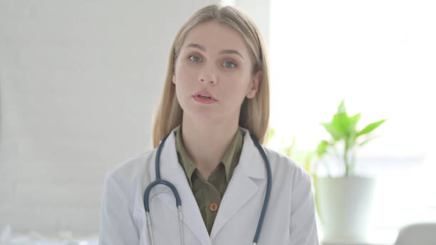istock Lady Doctor Talking on Online Video Conference 1465114145