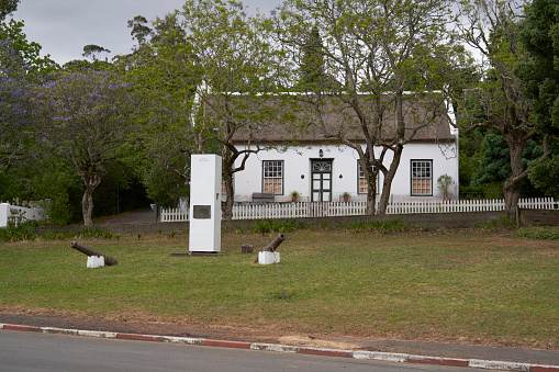 Swellendam, South Africa - 17 November 2022: Historic buildings in the Cape Dutch style of architecture in the town of Swellendam, Western Cape, South Africa