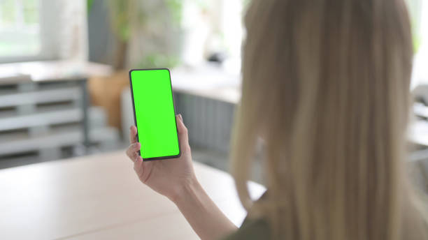istock Young Blonde Woman Using Smartphone with Green Screen 1465118978