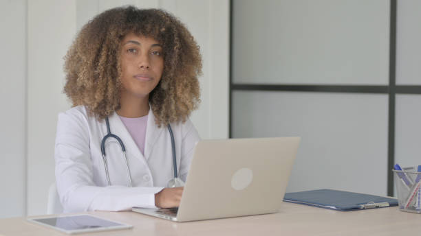 istock African Female Doctor Looking at Camera at Work in Clinic 1465120621